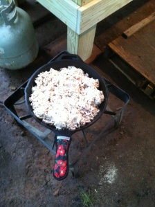 Rendering tallow in a cast iron skillet - outside. It can smell up the kitchen. 